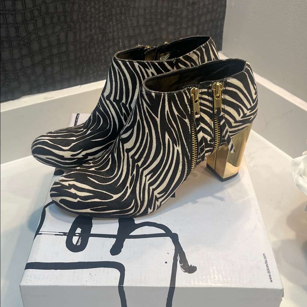 Size 8.5. Dolce Vita Zebra Calf fur. Double Side Zip, Gold Heels.  Never worn.